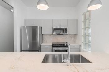 Custom cabinetry in kitchen and bathroom in a variety of finishes